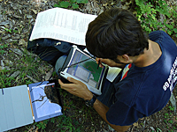 student using an iPad for geospatial location mapping