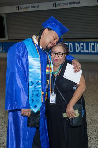 Commencement 2022 photo of Cordero Holmes and Roxie Holmes before the commencement ceremony