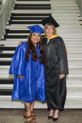 Commencement 2022 photo of President Smith graduate Tanya Brauer