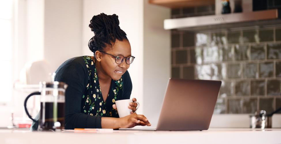 Woman working on a laptop at home