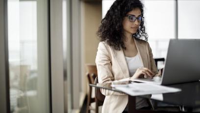 Woman working on a laptop in an office