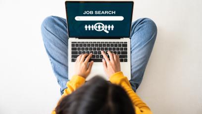 Woman searching for jobs on laptop