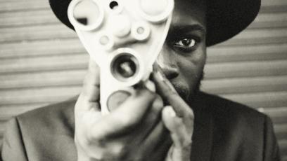 African-American man with a film camera