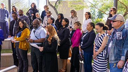 Rio employees and guests reciting a song during MLK Day event