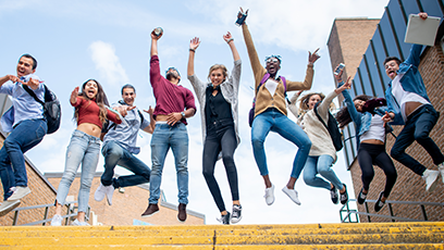 students jumping with text: We're celebrating community college month