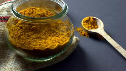 Turmeric powder in a mason jar