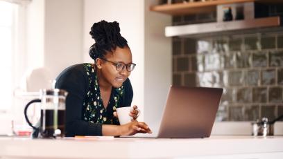 Woman working on laptop in home office