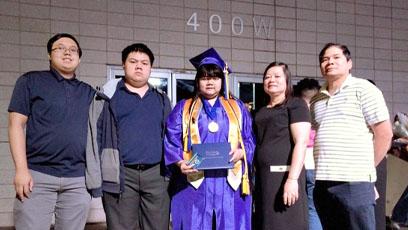 photo of the Nguyen family at Helen's college graduation