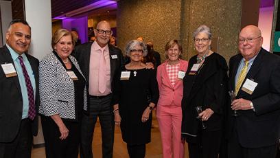 Pat Case with other Rio members posing for a photo at the event.