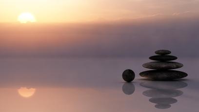 Meditative image of a stack of stones by the sea