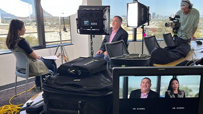 Rio faculty sit down with to PBS NewsHour reporter