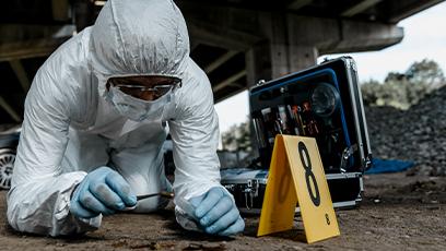 Senior forensic scientist working at crime scene