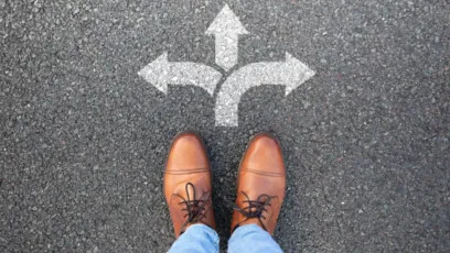 A pair of shoes stands at a crossroads