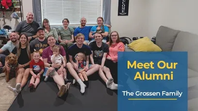 A large family group photo taken indoors, showing multiple adults, children, and a dog sitting together and smiling at the camera. On the right side, a blue text box reads: Meet Our Alumni – The Grossen Family.