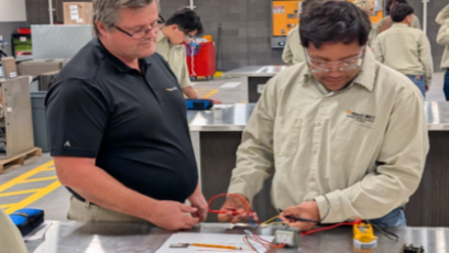 HVAC instructor works with students at the West-MEC Career Academy @ Agua Fria in Avondale, AZ.