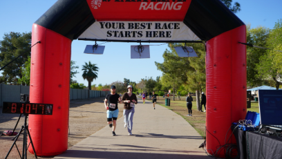 Last year's Dash with Rio at Kiwanis Park (runners running to archway)