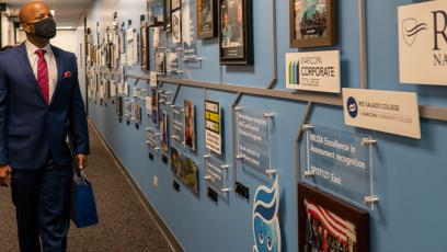 photo of Tempe Mayor Corey Woods looking at a wall display in the Rio Tower building