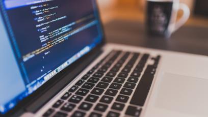 Coding on an open laptop