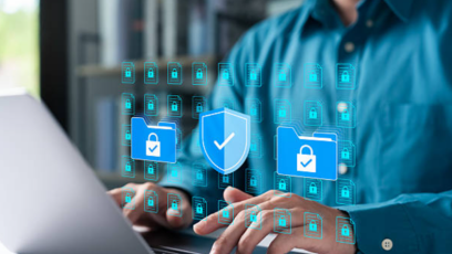Man typing on keyboard while security icons float overhead