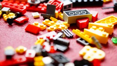 A pile of assorted Lego bricks on the floor