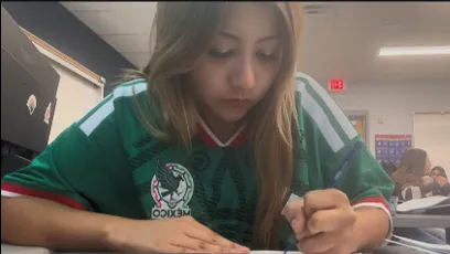 Allyson Hurtado Fernandez works on an assignment at her desk at Tempe High School as part of her day as a Dual Enrollment student.