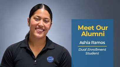 A promo graphic with a medium blue vertical block on the right overlaying a light gray studio background. On the left, Ashia Ramos smiles directly at the camera, wearing a black polo shirt with a round Nothing Bundt Cakes logo on the left chest. Her dark hair is styled back in a low pony. On the blue block, bold yellow text reads "Meet Our Alumni" above white text that reads "Ashia Ramos" underlined in yellow, followed by italicized text that reads "Dual Enrollment Student."