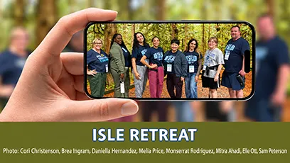 An image featuring a close-up of a hand holding up a smartphone against a blurred forest background. On the phone screen, eight Rio Salado College participants stand together outdoors surrounded by trees. Below the phone graphic, bold white text with blue outlining on a dark green banner reads "ISLE RETREAT", followed by photo credit text listing Cori Christenson, Brea Ingram, Daniella Hernandez, Melia Price, Monserrat Rodriguez, Mitra Ahadi, Elle Ott, and Sam Peterson.