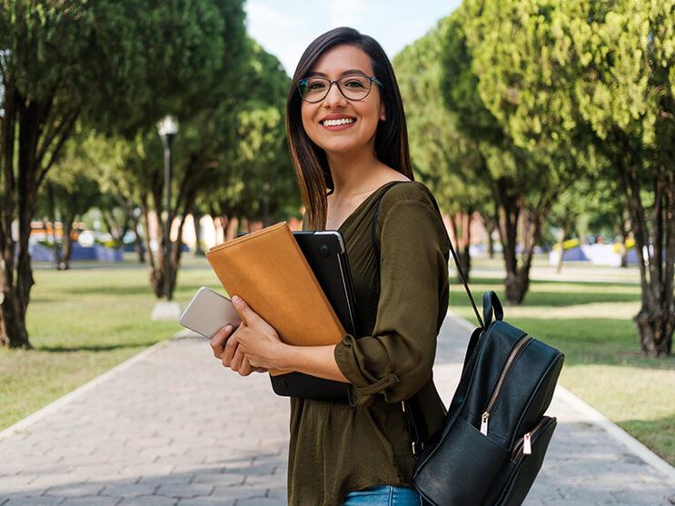 Student with book and bookbag