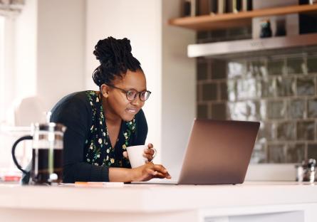 Woman working on a laptop at home