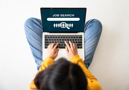 Woman searching for jobs on laptop