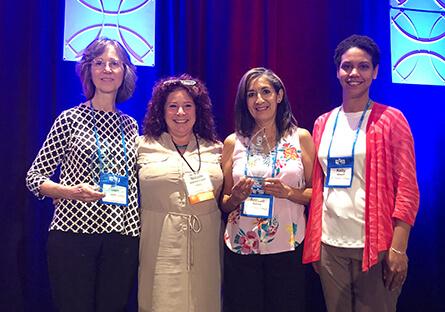 photo of Community Development team and student receiving awards