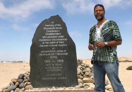 Dr. Lamont standing next to the Namibian genocide monument.
