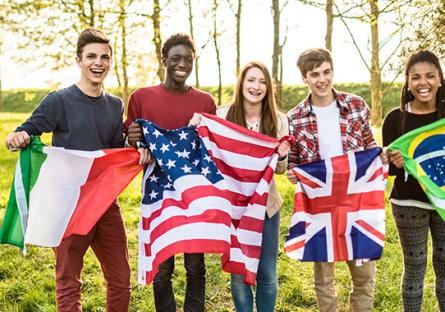 Multicultural group of students with world flags
