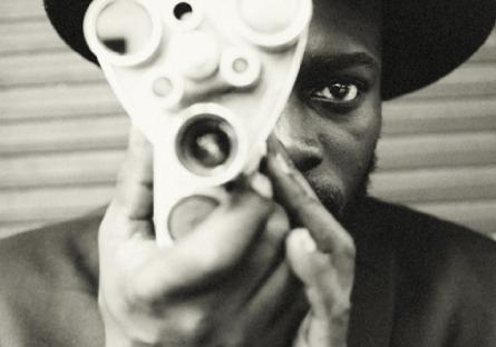 African-American man with a film camera