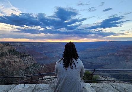Tara Hayman watching the sunset over the Grand Canyon