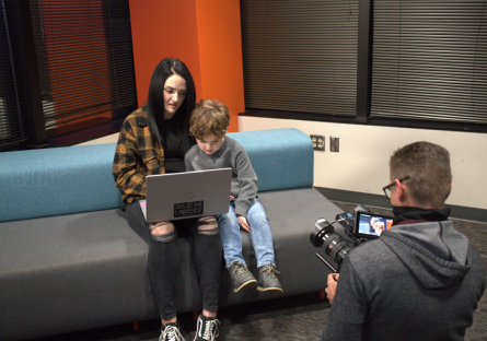 Jackie Elliott with her son, being interviewed at Rio Salado 