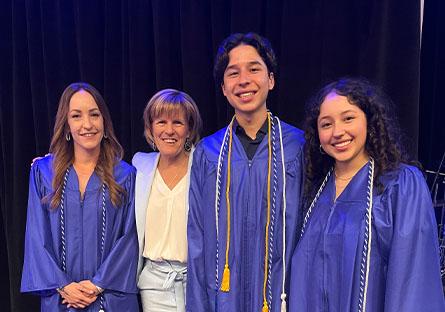 President Smith posing with the student speakers