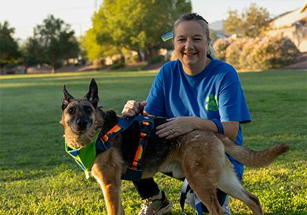 Tara posing with a German Shepard dog