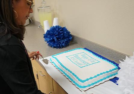 cake being cut at celebration