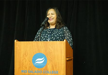 Student speaker, Norma Martinez, giving her speech at the podium