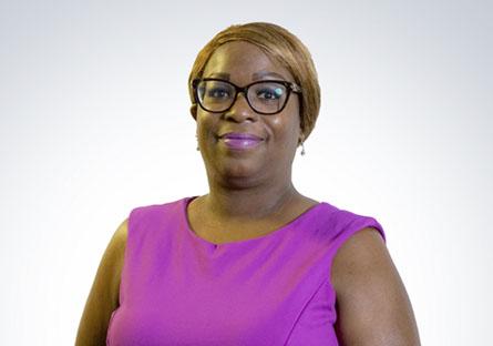 headshot of Kesha Shelton in a purple top in front of a white background