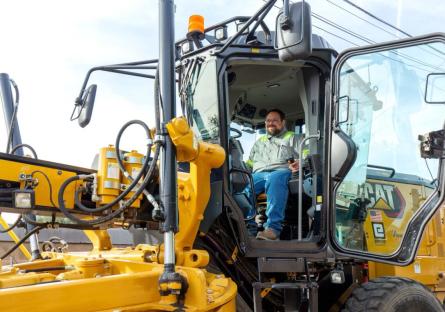 image of Shawn Campbell in a construction bulldozer