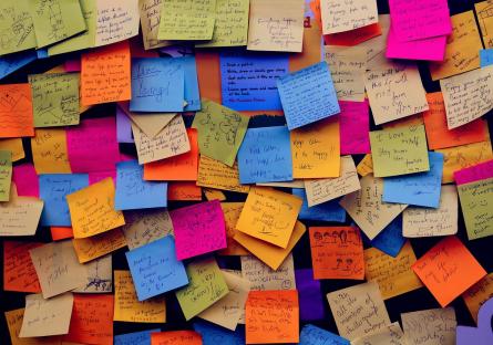 A wall of multi-colored post-it notes