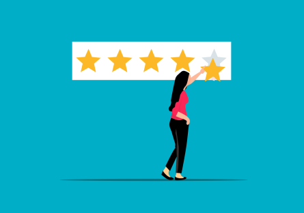 Woman taking a gold star off a five star ranking