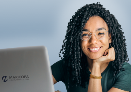 photo of a woman in front of a laptop