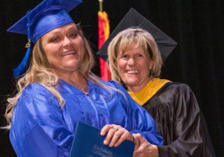 Kate Smith at 2019 commencement, congratulating a female graduate