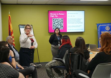 hosts discussing opportunities with attendees