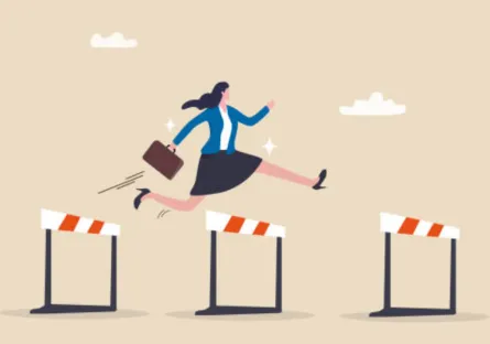Woman running and jumping over hurdles