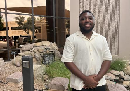 Tempe Rio Salado Student Ruben Joseph in front of building