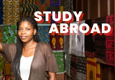 A woman stands in front of a colorful wall covered with patterned fabrics, smiling slightly while resting her hand on a doorway. The bold white and red text above her reads “STUDY ABROAD.”